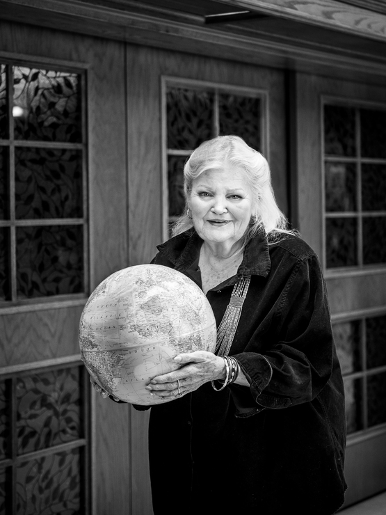 Jane Bagnall black and white portrait holding a globe