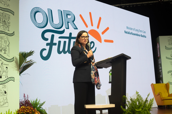 LTC Minister Natalia Kusendova-Bashta speaks upon the stage at the 2025 Operational Planning Retreat.