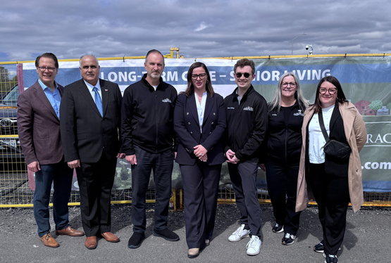 Jamie Schlegel is joined by the minister of long-term care and fellow team members during an official announcement celebrating to construction of The Village of Riverbank Terrace.