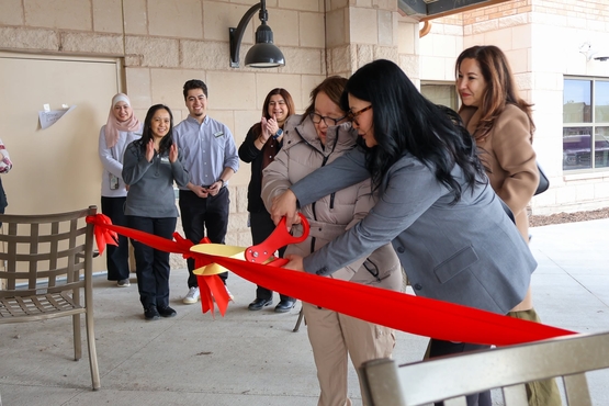 Ruth cuts the ceremonial ribbon alongside Ridgeview Court General Manager Donna Dalupam.