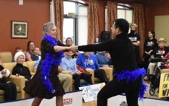 A resident and team member from Humber Heights compete in the "Figure Skating" event at the Schlegel Olympics.