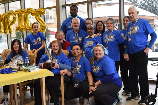 The team from Humber Heights celebrates their win with in terms of total medal count. 