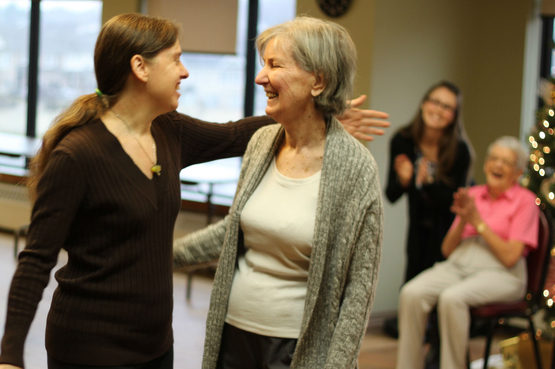 Shirley is smiling alongside her dance instructor at Taunton Mills.