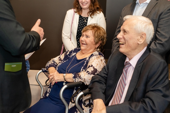 Doug and Jan Nash, who were featured in the documentary, share laughter with a visitor. 