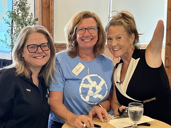 Unstoppable Tracy Schmitt poses with Sharon and Amy from The Village of Taunton Mills. 