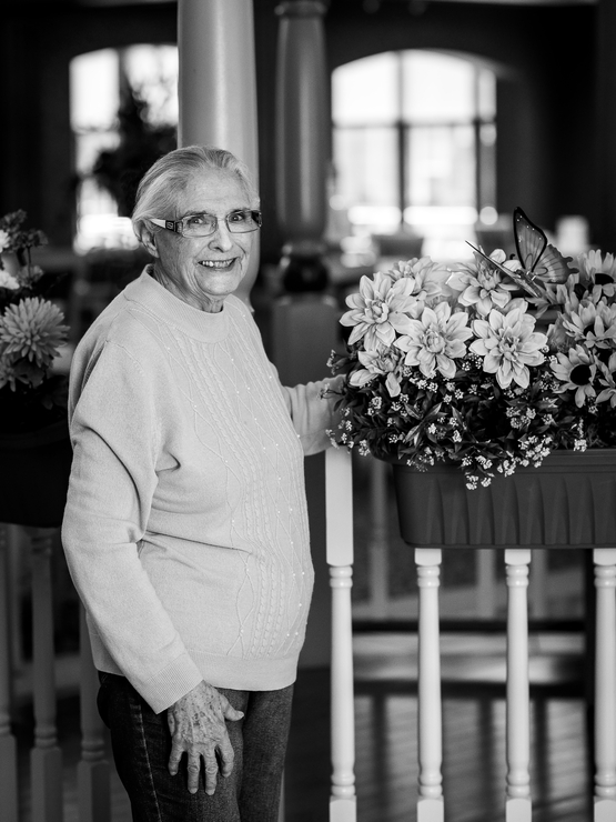 Ursula Penney black and white portrait with flowers