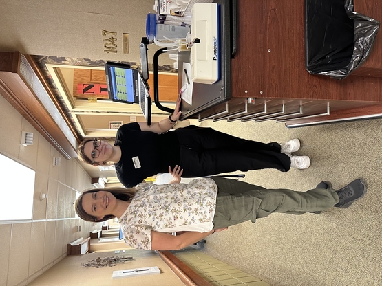 Valeriya works alongside a team member at The Village of Aspen Lake.