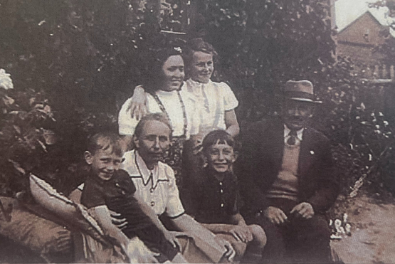 The Vogel family is pictured sitting together at their farm in Poland. 