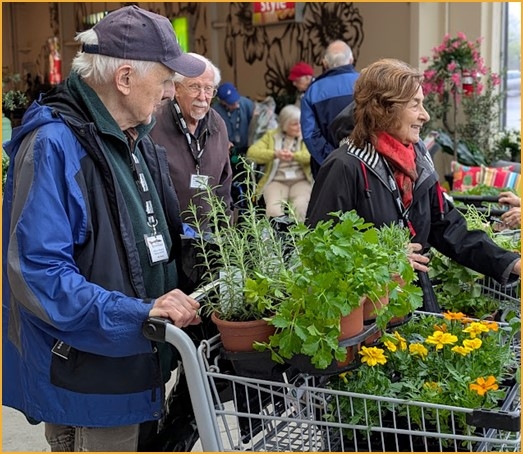 Garden Club members are pictured during their spring shopping trip in preparation for planting. 