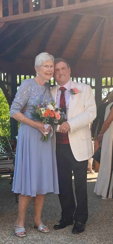 Beverley and Richard pictured together at their wedding ceremony at The Village of Tansley Woods. 