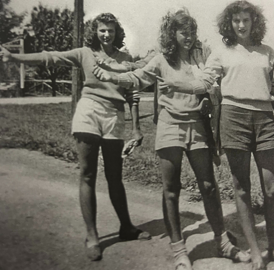 Gloria is pictured with two friends as young girls in the summer of 1946 or 1947 hitchhiking, as they often did on their days off from the fields.