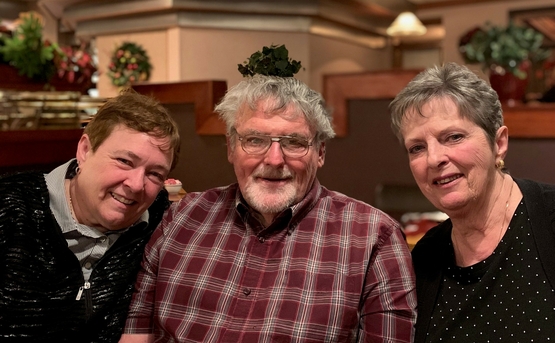 Rose, Ron and Mary Jane are pictured together at a restaurant table.