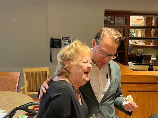 Susan laughs alongside Jamie Schlegel during the Wentworth Heights celebrations. 