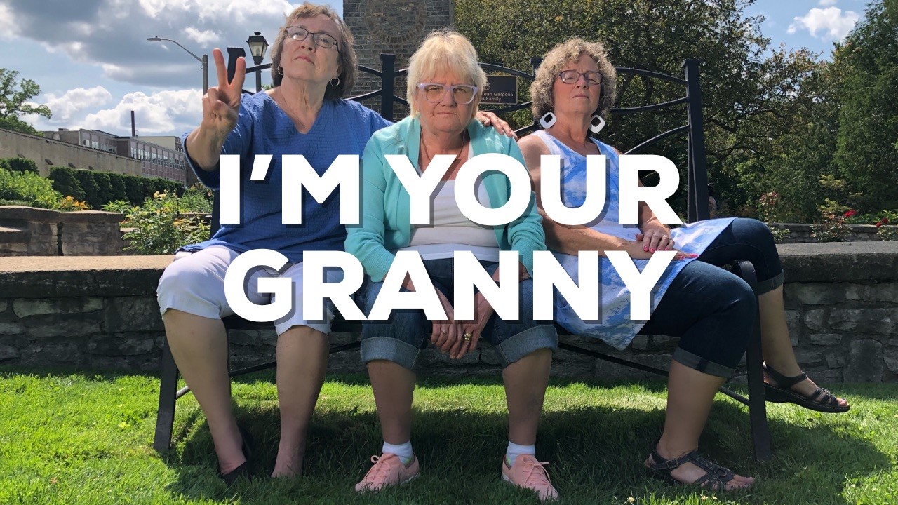 Granny Reynolds and friends on a bench with the text "I'm Your Granny"