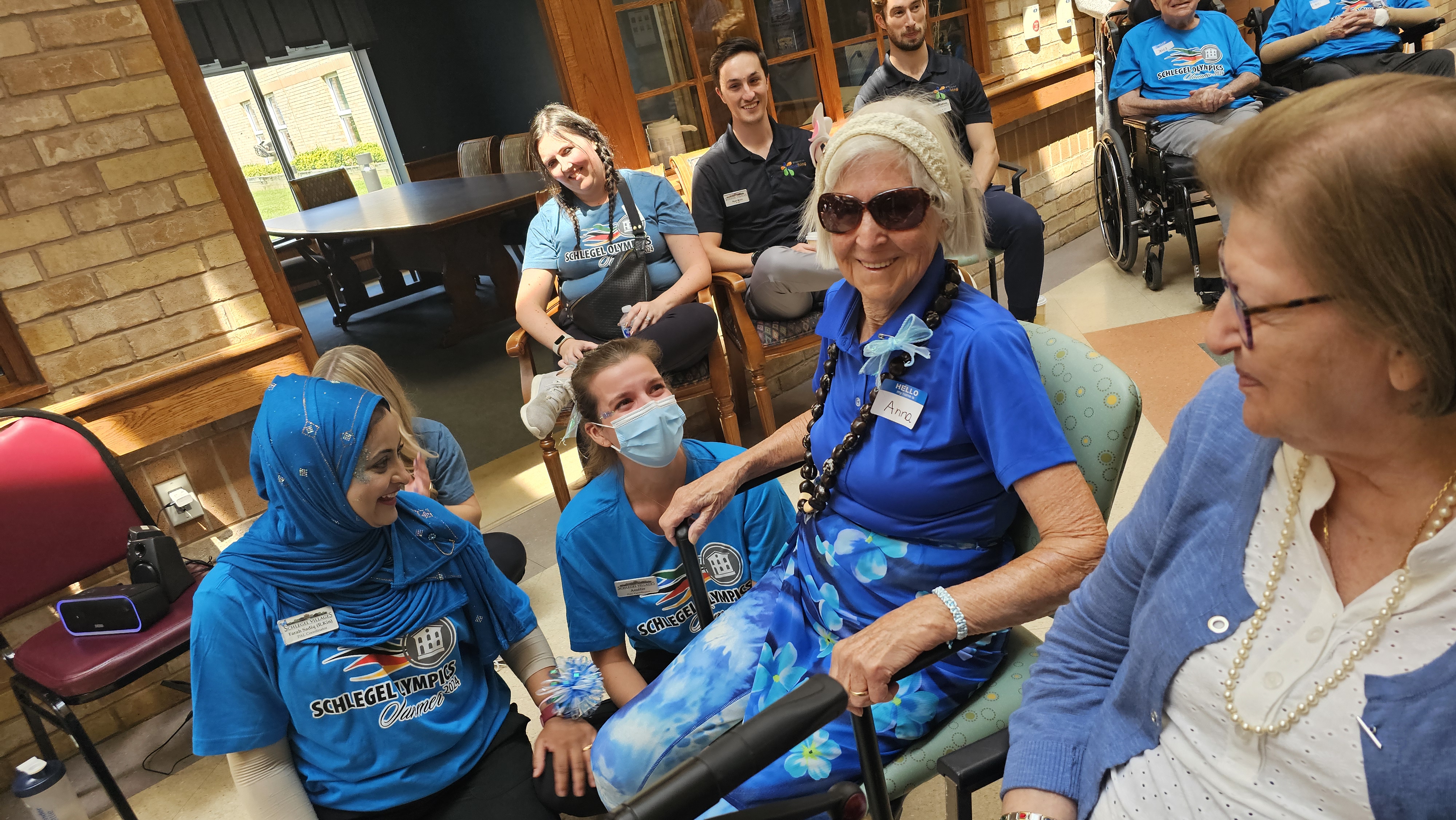 A resident named Anna is adored by two team members after she won a medal during the Schlegel Olympics.