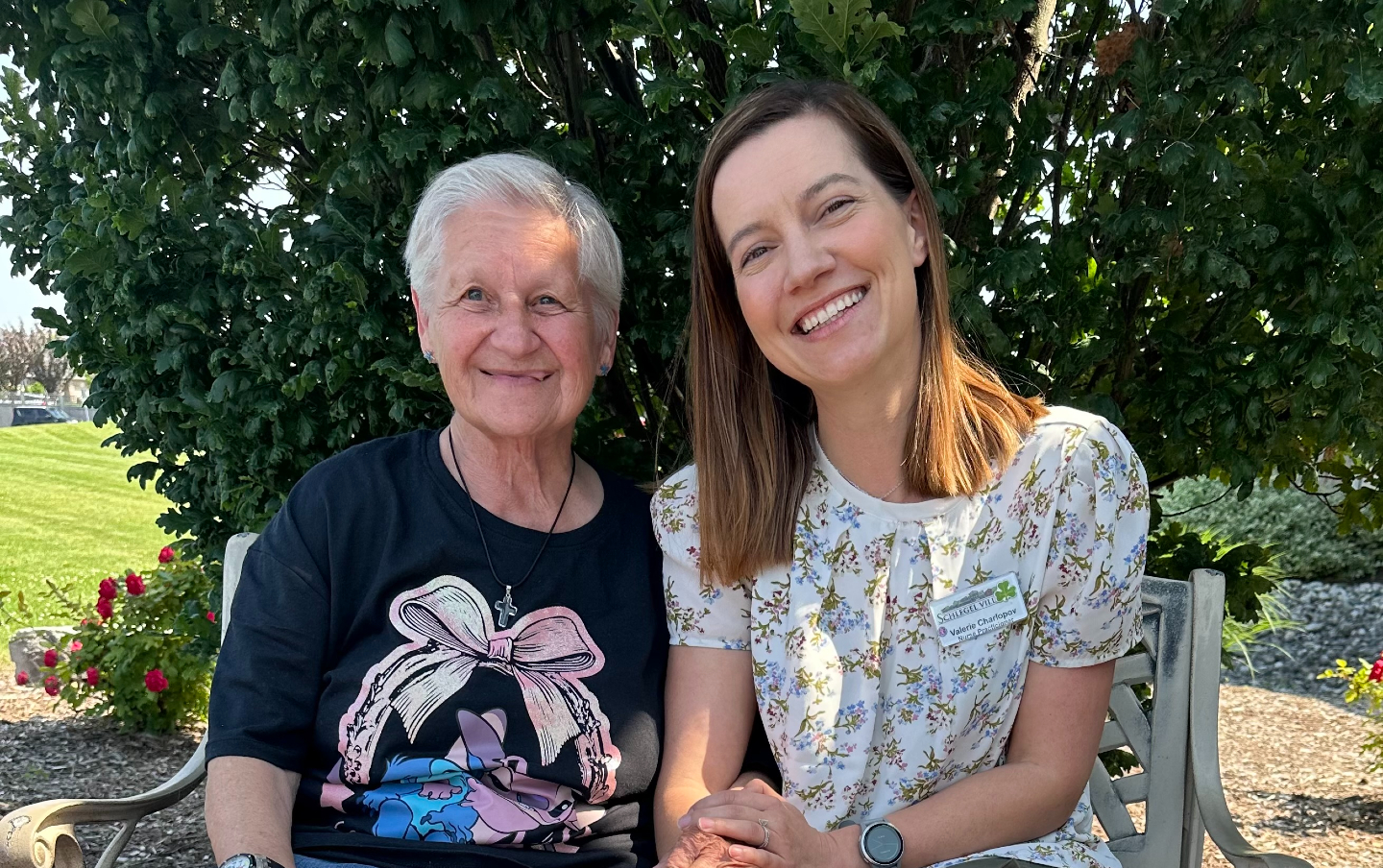 Valeriya sits outside alongside one of the many residents from The Village of Aspen Lake she has developed meaningful relationships with over the years.