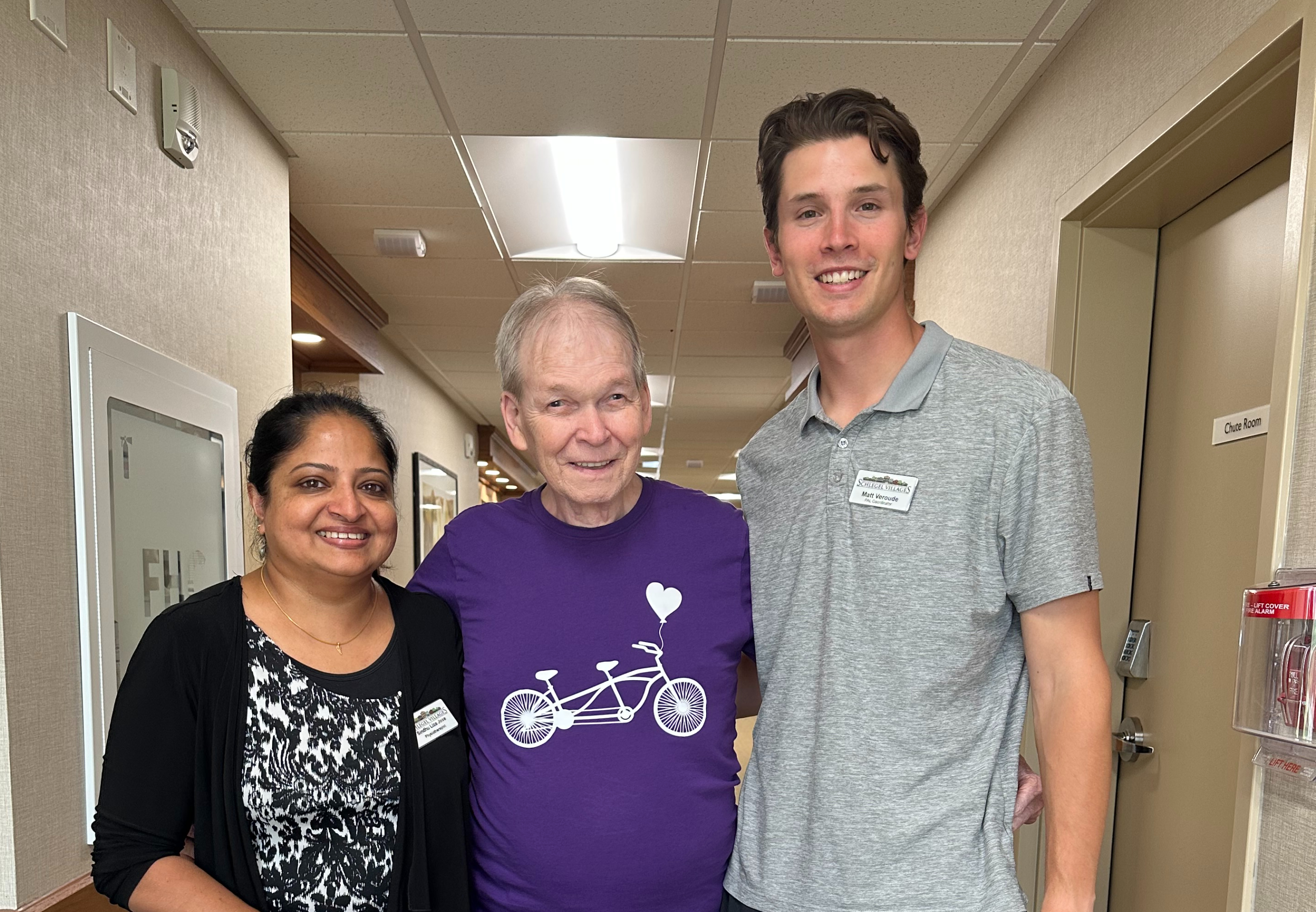 Harry stands alongside Physiotherapist Sindhu Jose, and PAL Coordinator Matt Veroude, who are key parts of the team that supported Harry in regaining his strength. 