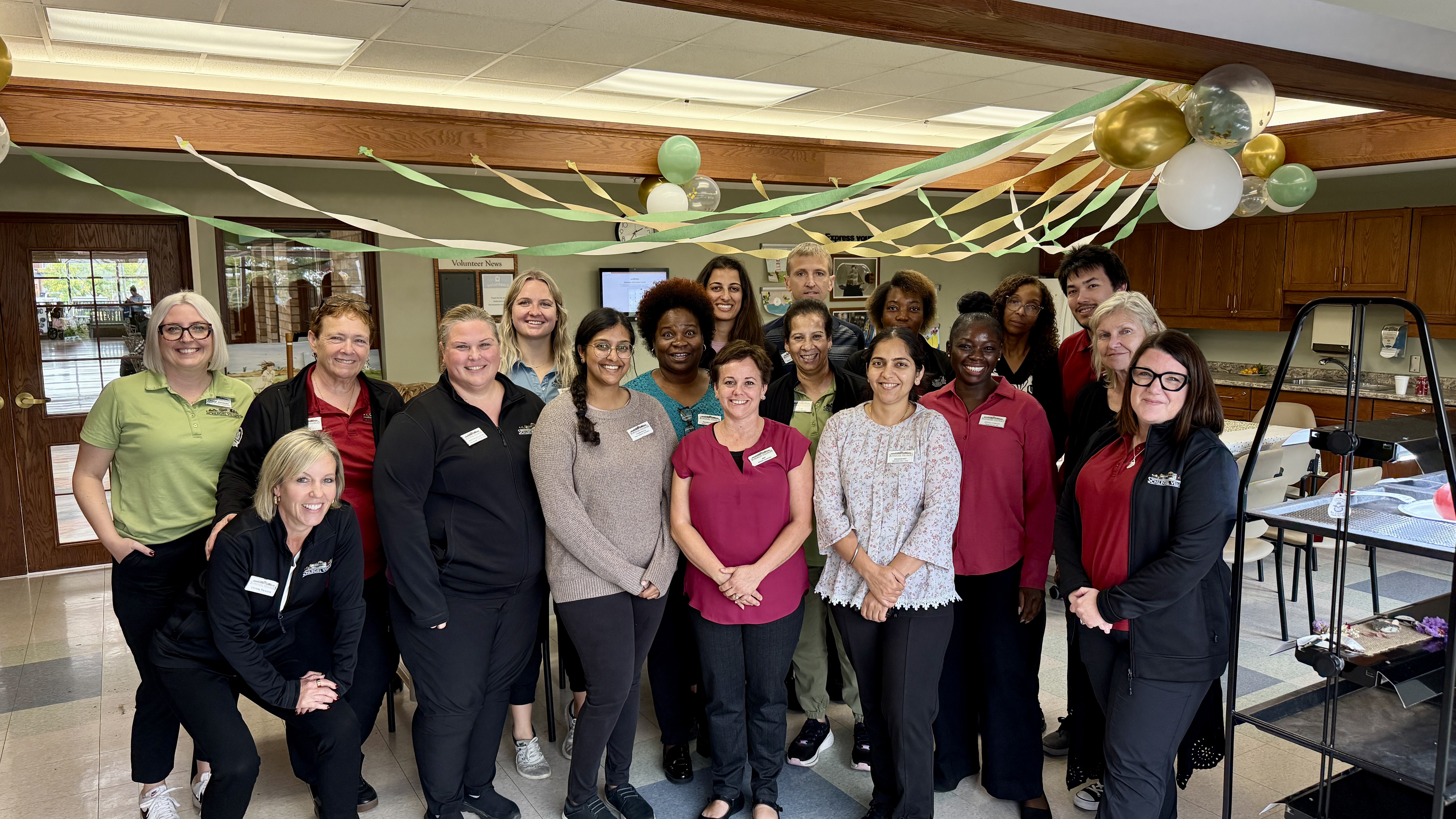 The Sandalwood Park leadership team gathers with members from the Support Office to celebrate the successful launch of three key initiatives at the Village. 