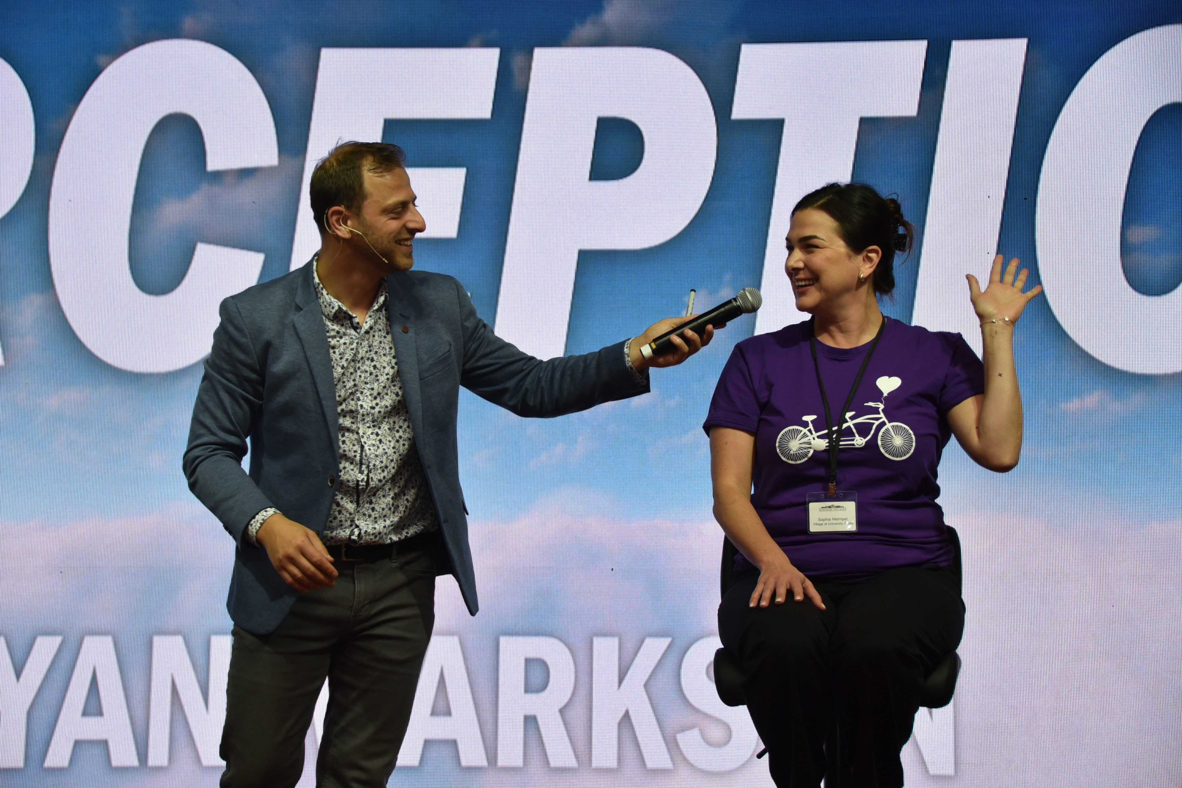 Mentalist Yan Markson engages with a team member on stage during his keynote address at the Operational Planning Retreat. 