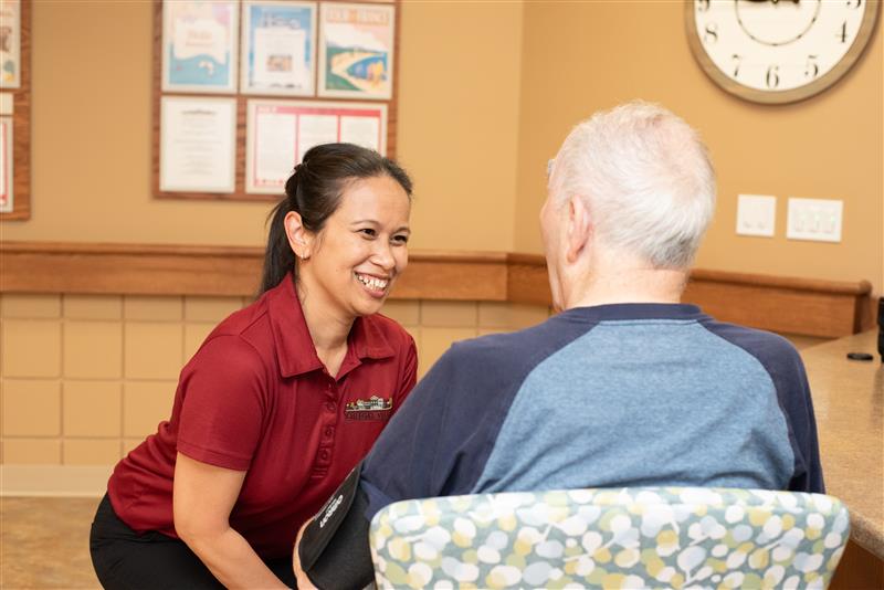 Team member smiling with resident