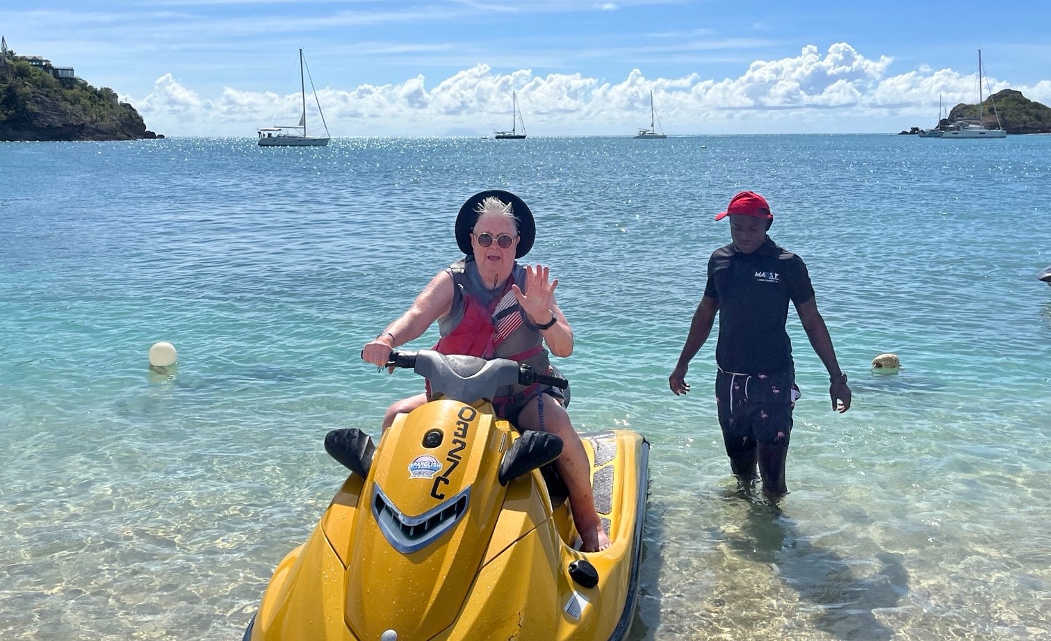 A resident from Tansley Woods sits upon a Sea-Doo in the Caribbean Sea. 