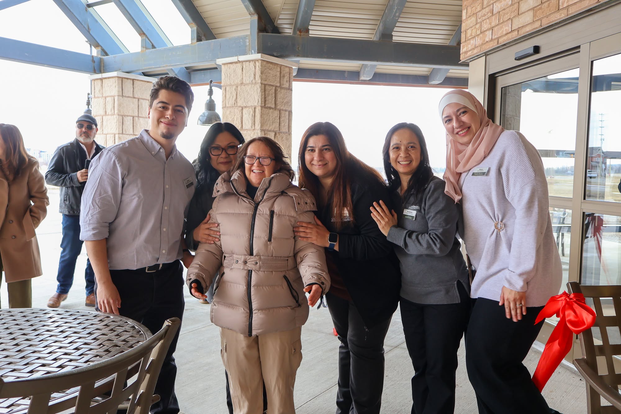 Ruth is pictured with some of the Ridgeview Court team members on the day the new Village opened. 