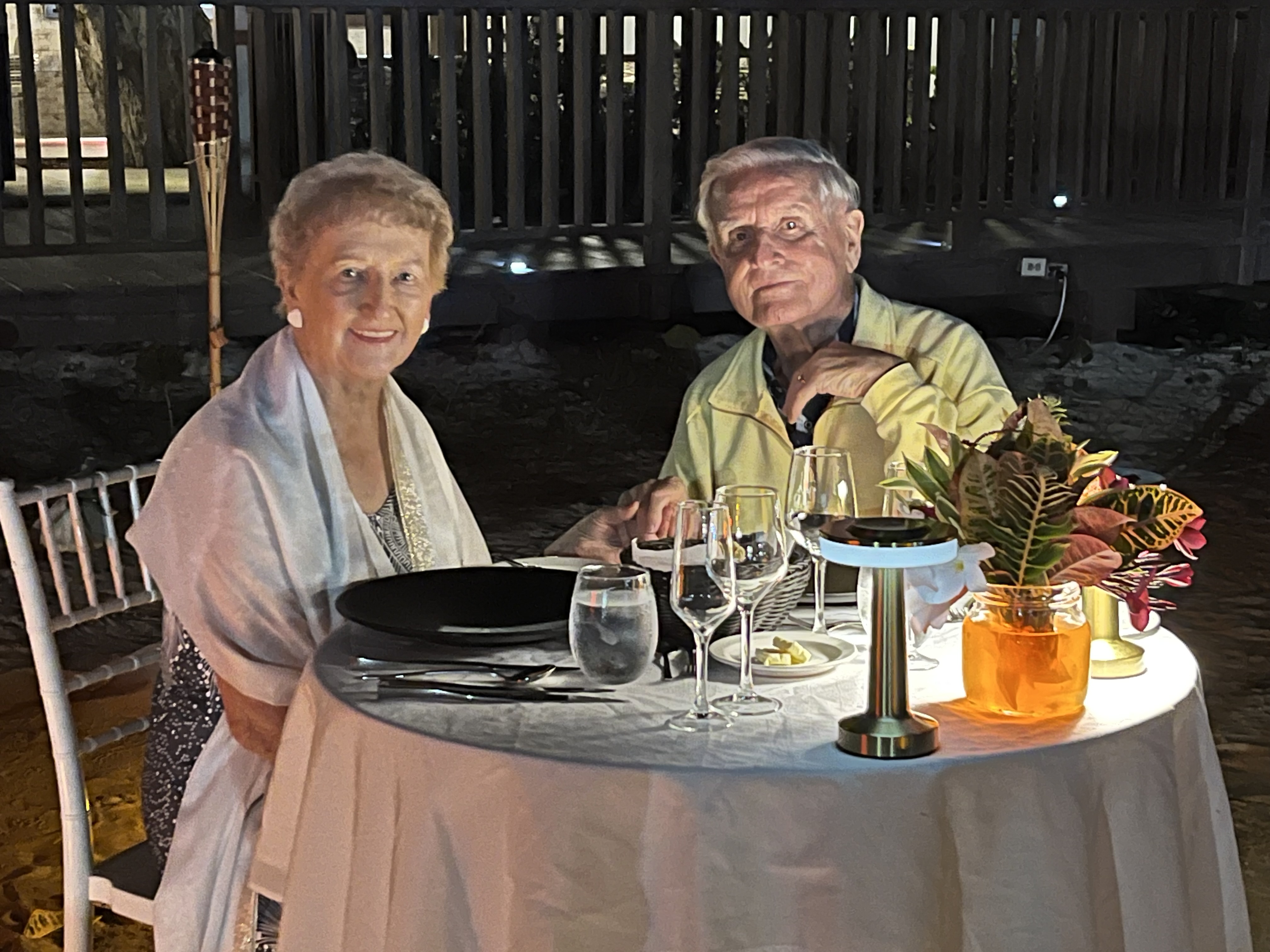 Esme and Don enjoy a romantic dinner on the beach in Antigua. 