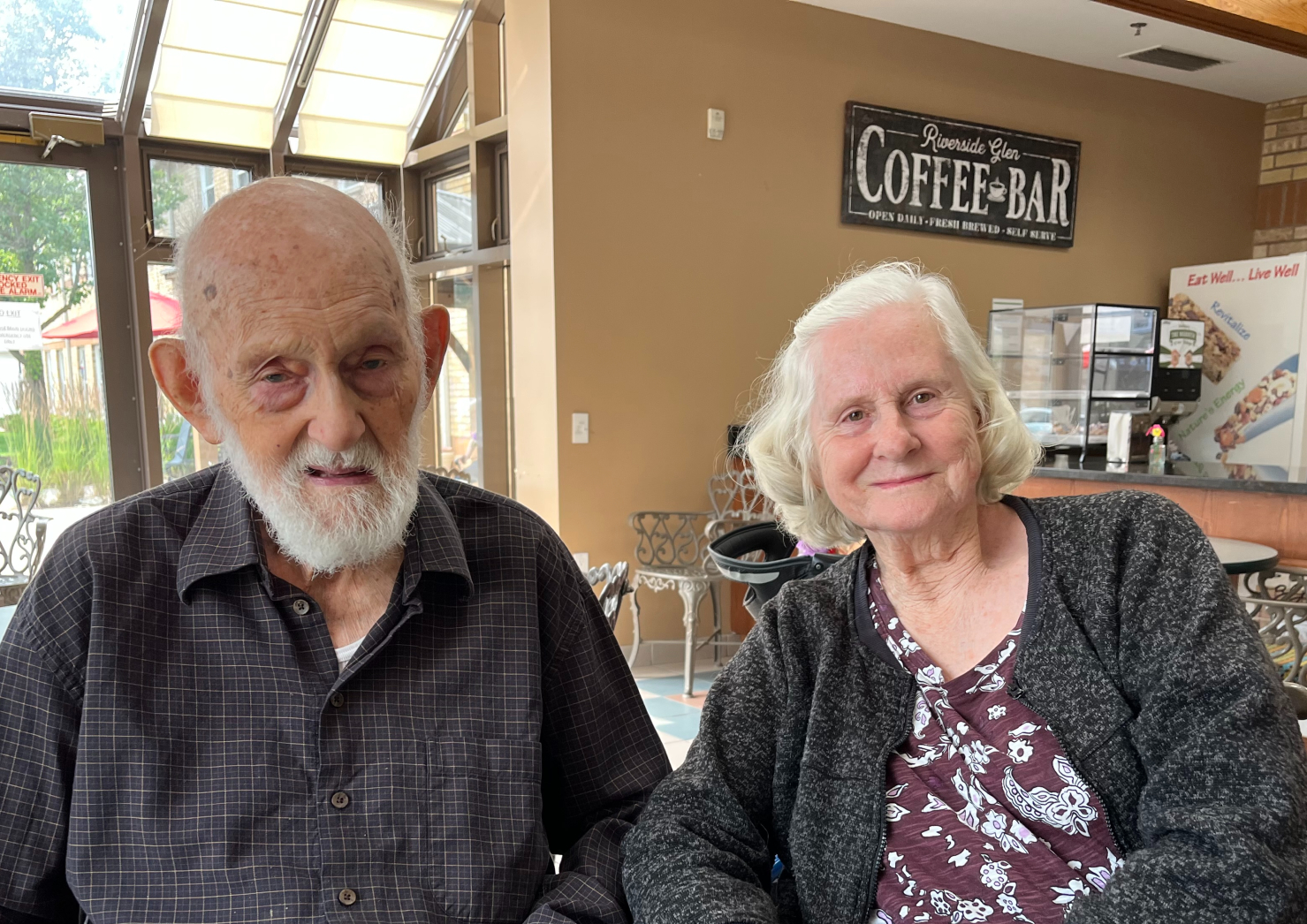 James and Anne are pictured together in the cafe at The Village of Riverside Glen. 