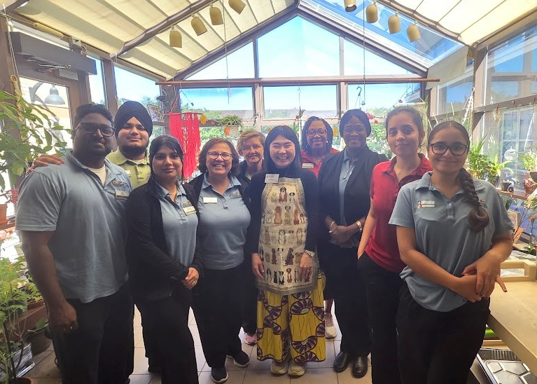 Flo is pictured in the centre of the team at Erin Meadows, where she spent several months on a placement while studying Art Therapy.