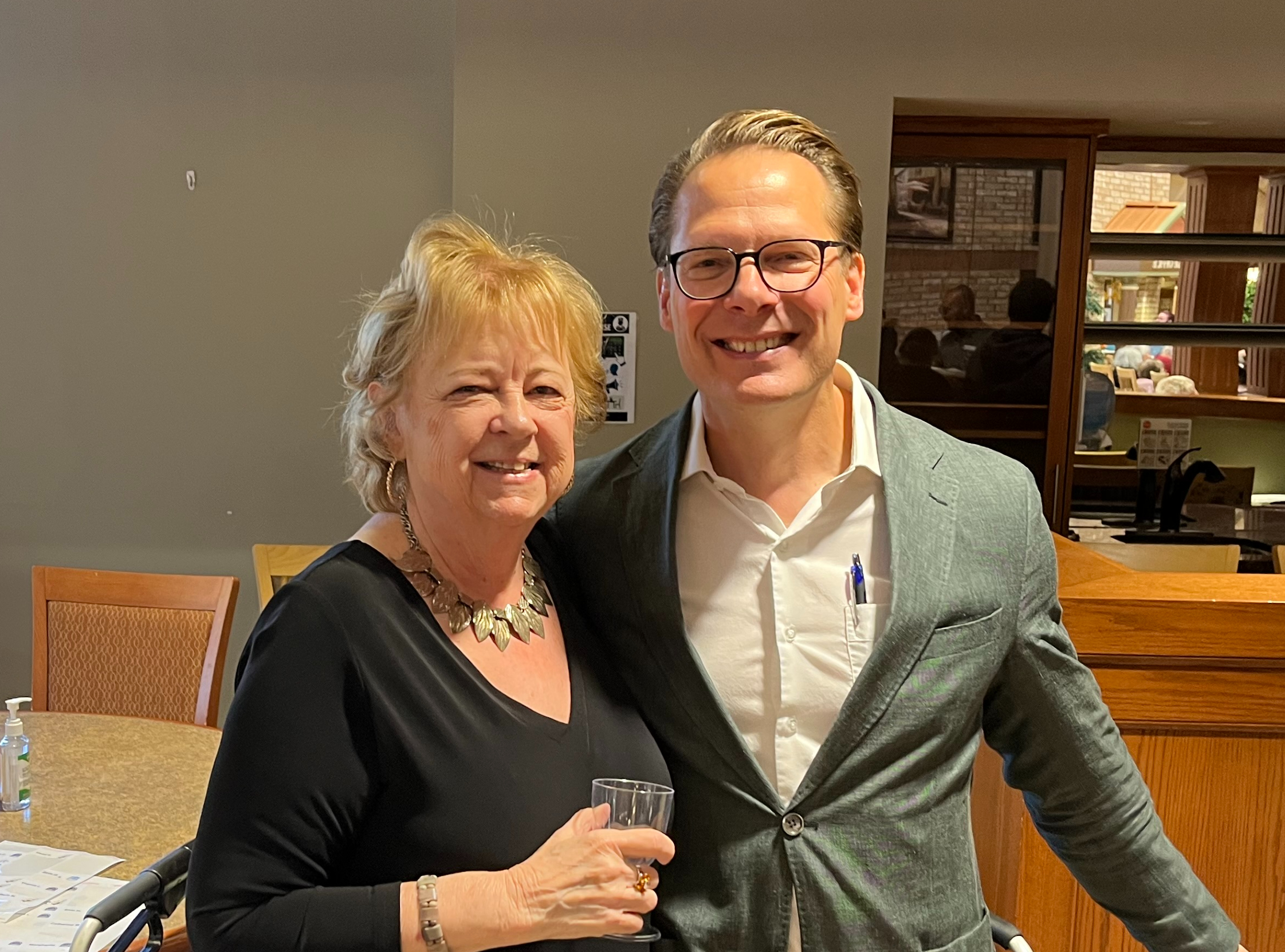 Susan and Jamie pose together smiling at the 25th Anniversary celebration at The Village of Wentworth Heights. 