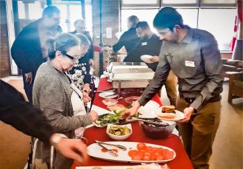 Team members at Winston Park enjoy a fund-raising Australian-themed Barbecue. 