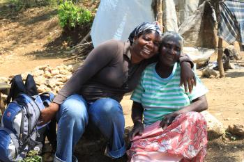 CLM Case Manager Josiane with her arm around member Anne Ilama.