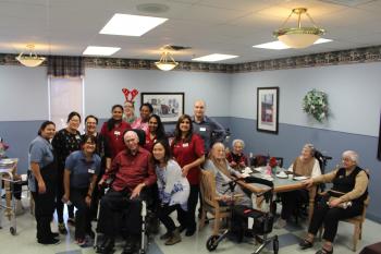 Dundas Neighbourhood group photo with team members and resident 