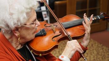 Resident playing the violin