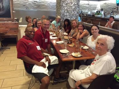 Schlegel Ambassadors sitting around a table at the conference for a meal 